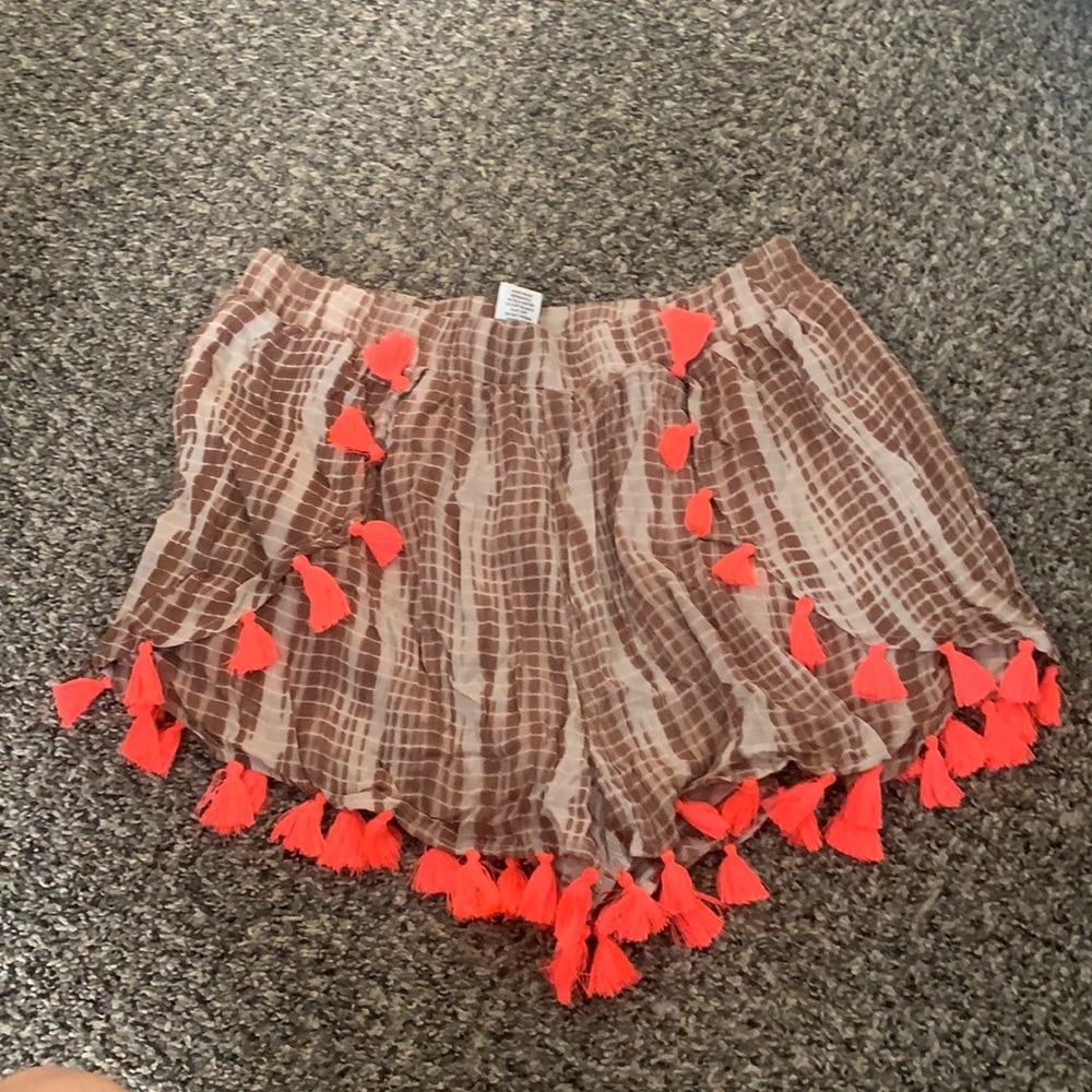 Never worn tyedye shorts with neon pink pompoms